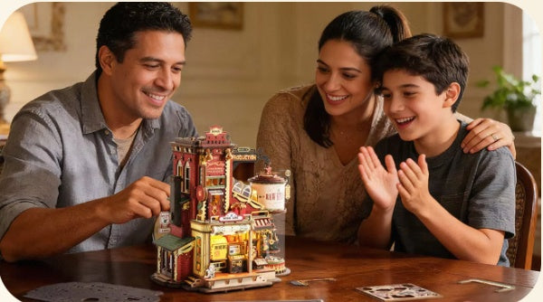 Family building a glowing DIY miniature house kit together at the kitchen table
