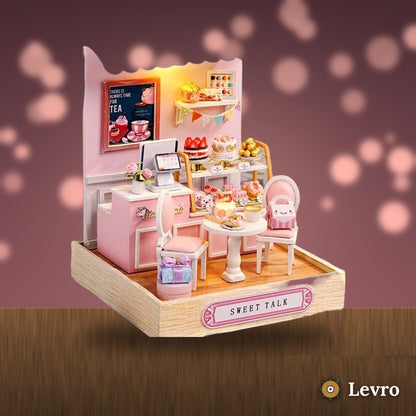 Sweet Cake Shop miniature kit glowing on a cozy shelf at night